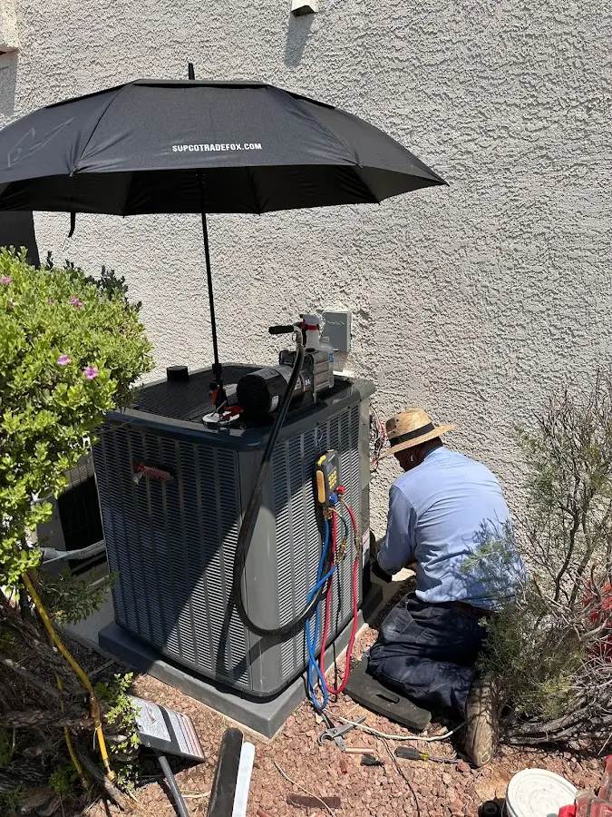 HVAC technician performing outdoor AC maintenance in Palmetto